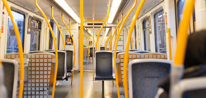 Interior of an empty Metro car seen from one end to the other.